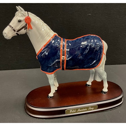 52 - A Beswick (Royal Doulton) Welsh Mountain Pony, A247, wooden base.