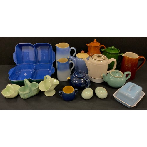 69 - Denby kitchen including; dual oven dishes, a set of two tone blue jugs, butter dish, tea pot, salts;... 