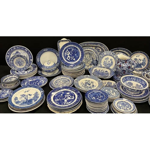 85 - A quantity of blue and white ware including; Booths Real Old Willow, Wedgwood, flow blue leaf plate;... 