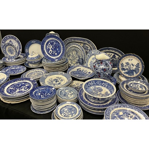 85 - A quantity of blue and white ware including; Booths Real Old Willow, Wedgwood, flow blue leaf plate;... 