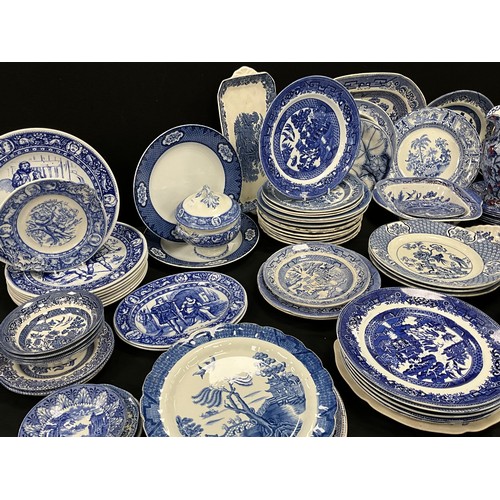 85 - A quantity of blue and white ware including; Booths Real Old Willow, Wedgwood, flow blue leaf plate;... 