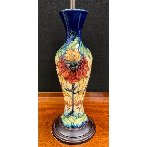 99 - A Moorcroft Anna Lily pattern baluster-form table lamp, 43cm high (65cm high with shade).