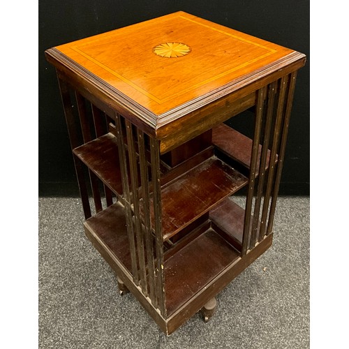 101 - A late Victorian/ Edwardian inlaid walnut two tier revolving bookcase, 86cm high, 47.5cm square. c.1... 