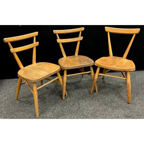 103 - A pair of c.1930’s elm children’s chairs, and another similar, (3).