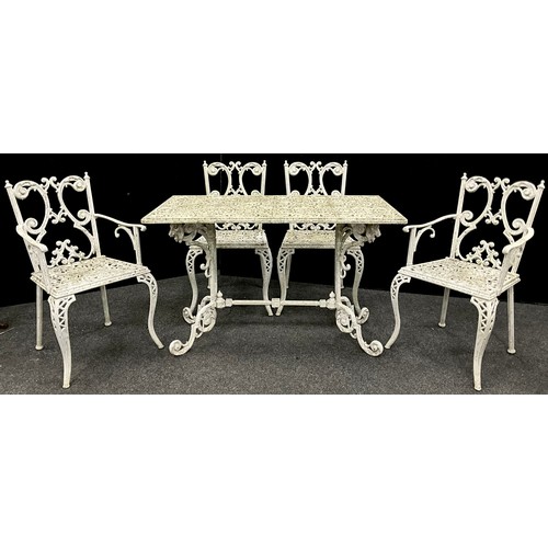 120 - Garden furniture - A cast iron table and set of four chairs, the table having a rounded-rectangular ... 