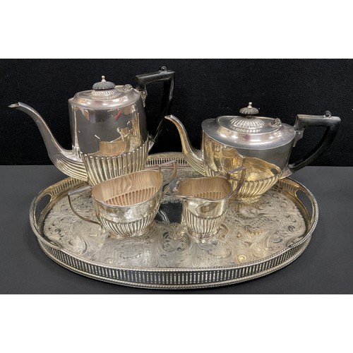 129 - A silver plated four piece tea set on tray, gadrooned body (5)