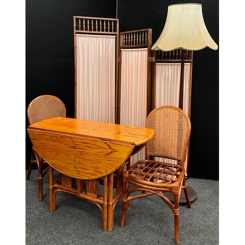 139 - A pine and bentwood bistro set, comprising drop-leaf table and pair of chairs, with woven split cane... 