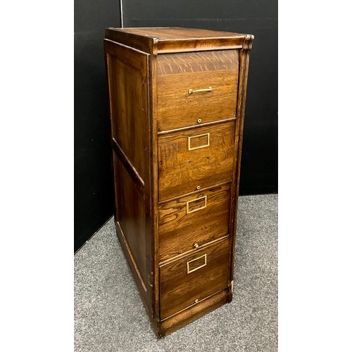 154 - An oak filing cabinet by 'Amberg', the rectangular top over four deep drawers raised on plinth base,... 