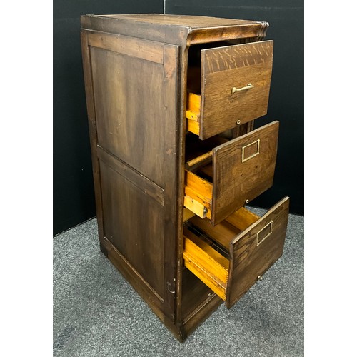 154 - An oak filing cabinet by 'Amberg', the rectangular top over four deep drawers raised on plinth base,... 