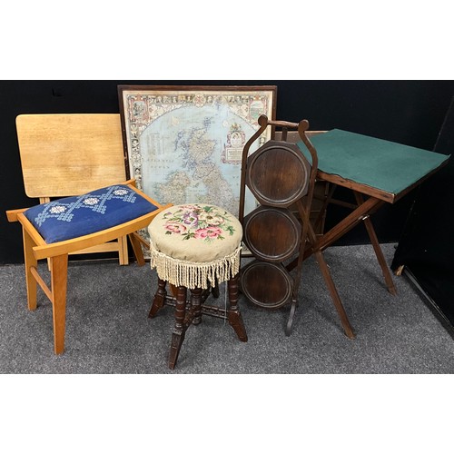 159 - A Victorian mahogany rise and fall piano stool;  c.1900 oak three tier cake stand;  framed map off t... 