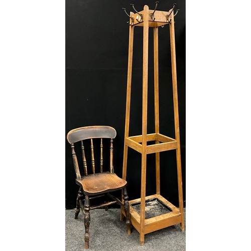 162 - An early 20th century oak coat, hat and stick stand, of tapering square form, with metal drip-tray t... 