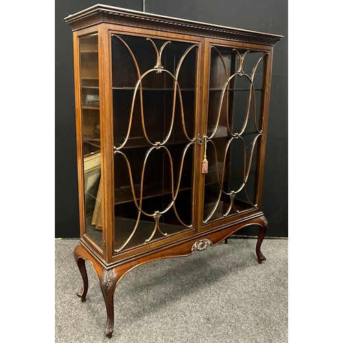 166 - A Victorian mahogany china display cabinet, carved pediment, pair of glazed doors enclosing three ti... 