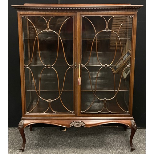 166 - A Victorian mahogany china display cabinet, carved pediment, pair of glazed doors enclosing three ti... 