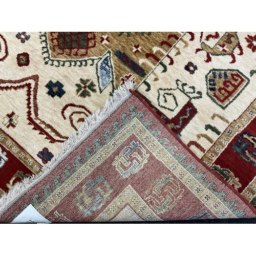 171 - A Kabir rug/carpet, two principle shaped medallions within cream field, rustet red cream and green m... 