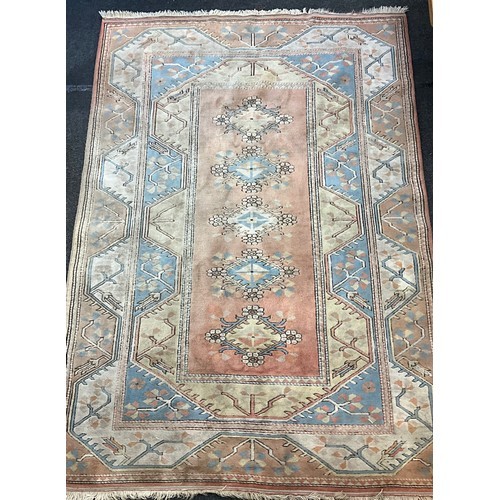 175 - A Turkish Milas rug,in tones of muted reds and yellows, 288cm x 199cm.