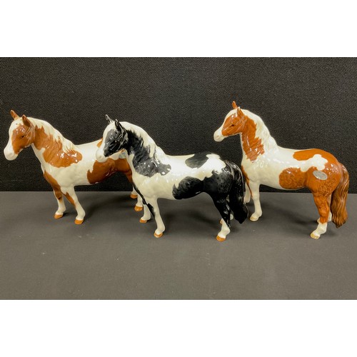 15 - Beswick ponies including; Skewbald and Piebald, 17cm high (3)