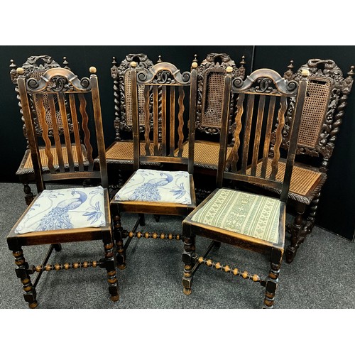 203 - A set of four Jacobean revival carved oak Bergere seated chairs, vine and barley twist backs, and le... 