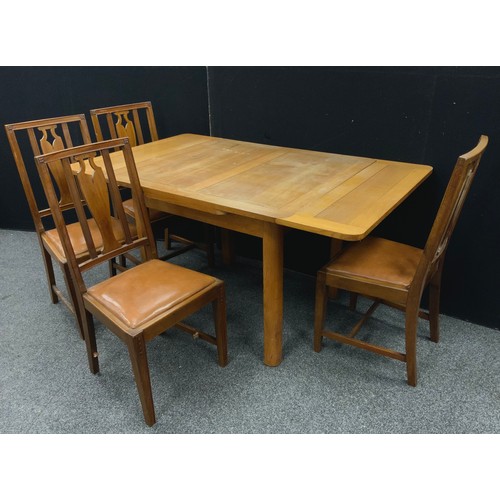 204 - A 1930’s oak draw-leaf dining table, with set of four dining chairs.