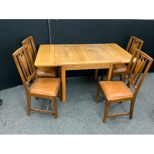 204 - A 1930’s oak draw-leaf dining table, with set of four dining chairs.