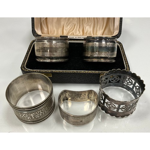 222 - A pair of cased silver napkin rings, Angora Silver Plate Co Ltd, Birmingham 1938;  another Birmingha... 