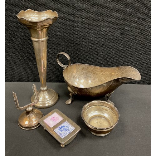 226 - An Edwardian silver table salt, Birmingham 1901;  desk calendar, marks worn;  stamp case, Sheffield ... 