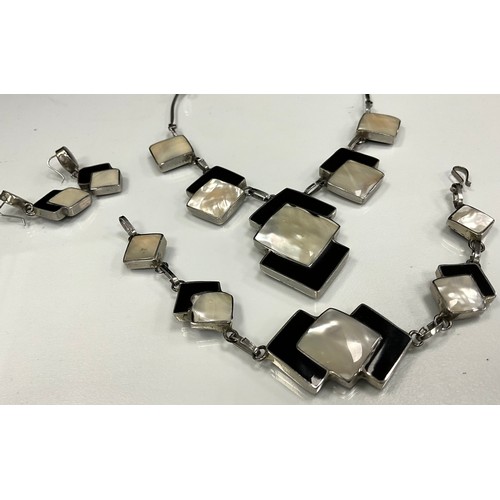 231 - An Art Deco style black glass and mother of pearl  necklace, bracelet and earrings suite, unmarked s... 