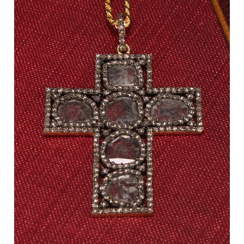 243 - A silver gilt diamond cross pendant, set with slice-cut and rose-cut diamonds, silver rope link chai... 