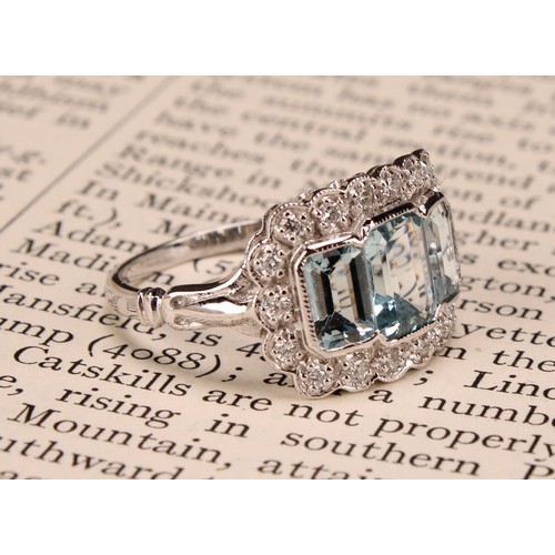 244 - An 18ct white gold aquamarine and diamond ring, emerald-cut aquamarines 1.74ct, diamonds 0.26ct, siz... 