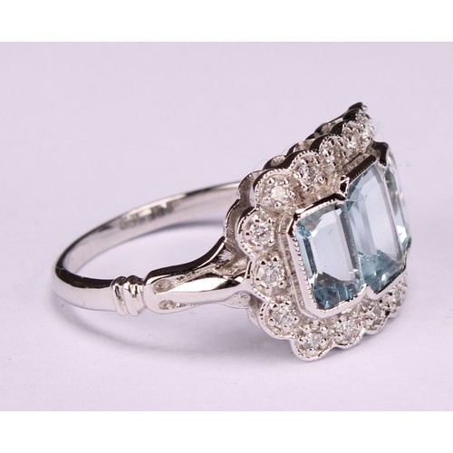 244 - An 18ct white gold aquamarine and diamond ring, emerald-cut aquamarines 1.74ct, diamonds 0.26ct, siz... 