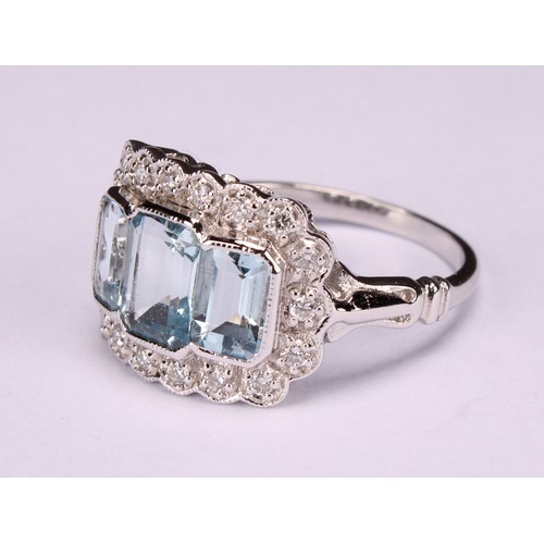 244 - An 18ct white gold aquamarine and diamond ring, emerald-cut aquamarines 1.74ct, diamonds 0.26ct, siz... 