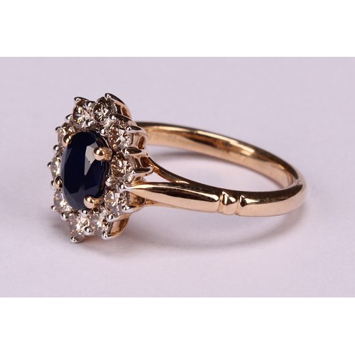 245 - A 9ct gold sapphire and diamond cluster ring, oval sapphire 1.00ct approx, round brilliant cut diamo... 