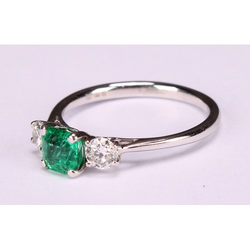 249 - An 18ct white gold diamond and emerald three stone ring, emerald 0.66ct, diamonds 0.37ct, size L