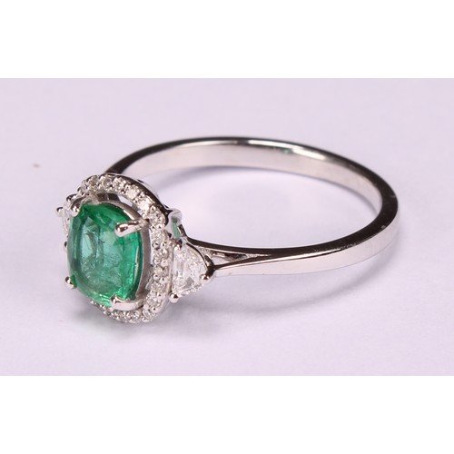 253 - An 18ct white gold emerald and diamond cluster ring, emerald 0.79ct, diamonds 0.28ct, size N