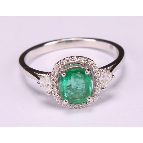 253 - An 18ct white gold emerald and diamond cluster ring, emerald 0.79ct, diamonds 0.28ct, size N