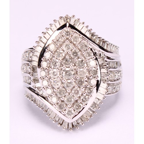 254 - A Large 9ct white gold navette swirl diamond cluster dress ring set with round brilliant and baguett... 