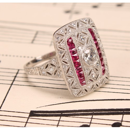 255 - A Large Art Deco style platinum ring set with old-cut and eight-cut diamonds and rubies with milligr... 