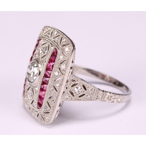 255 - A Large Art Deco style platinum ring set with old-cut and eight-cut diamonds and rubies with milligr... 