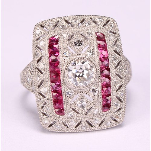 255 - A Large Art Deco style platinum ring set with old-cut and eight-cut diamonds and rubies with milligr... 