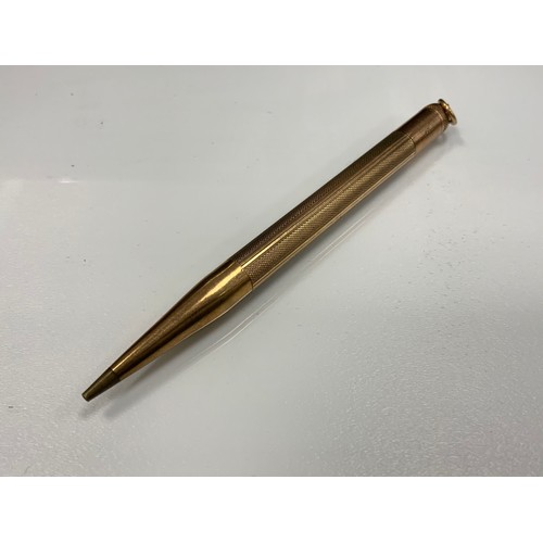 259 - A 9ct gold cased telescopic Power propelling pencil, 19g gross