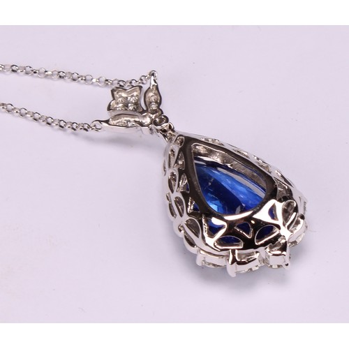 268 - An 18ct white gold pendant, set with a pear shaped tanzanite surrounded by round brilliant, pear and... 