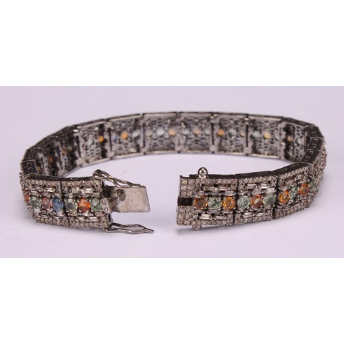 269 - An Art Deco style line bracelet set with multicoloured sapphires 
and round and baguette cut diamond... 