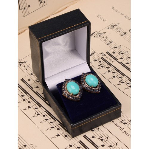 270 - A pair of vintage-styled silver-gilt stud earrings set with large oval turquoise, round-cut sapphire... 