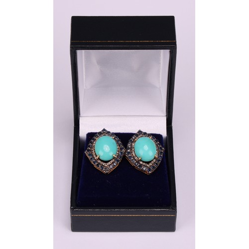 270 - A pair of vintage-styled silver-gilt stud earrings set with large oval turquoise, round-cut sapphire... 