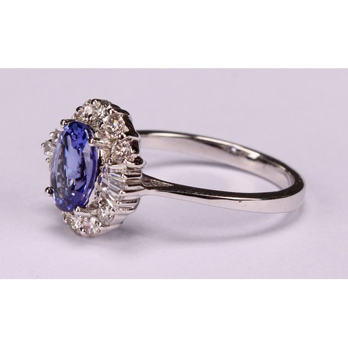 271 - An 18ct white gold oval tanzanite and diamond cluster ring. oval Tanzanite 1.34ct. Round brilliant c... 