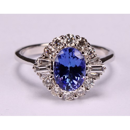 271 - An 18ct white gold oval tanzanite and diamond cluster ring. oval Tanzanite 1.34ct. Round brilliant c... 