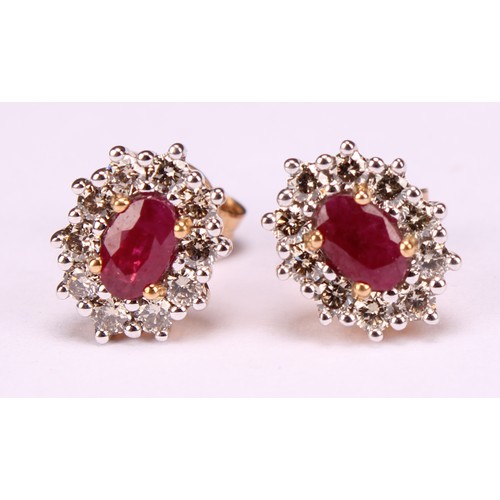 273 - A pair of 9ct yellow and white gold oval ruby and RBC diamond cluster studs, boxed. Rubies 0.62ct. D... 