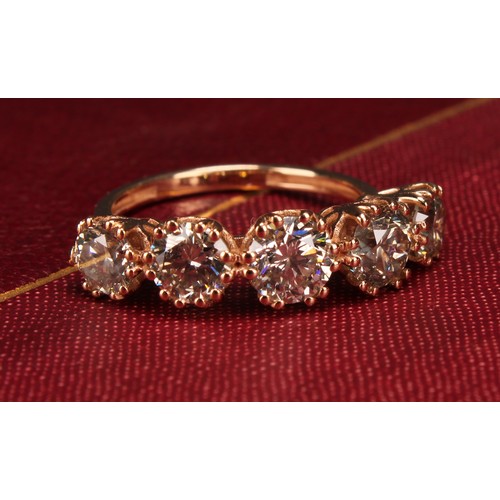 276 - An 18ct rose gold five stone diamond ring, graduated round brilliant cut diamonds 3.19ct, Cert no. W... 