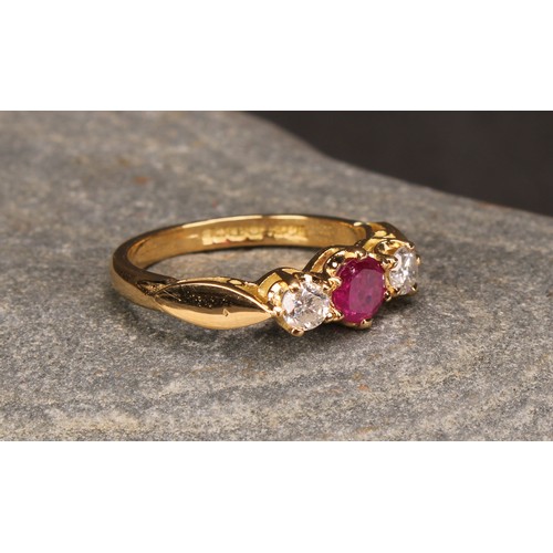 277 - An 18ct gold three stone diamond and ruby ring, diamonds 0.34ct, ruby 0.58ct, size M