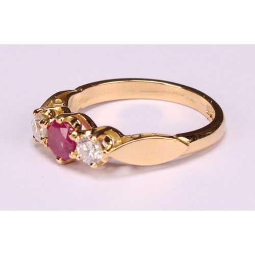 277 - An 18ct gold three stone diamond and ruby ring, diamonds 0.34ct, ruby 0.58ct, size M