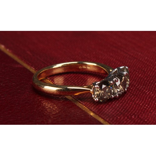 279 - An 18ct white and yellow gold three stone diamond ring, round brilliant cut diamonds 1.86ct. WGI Cer... 